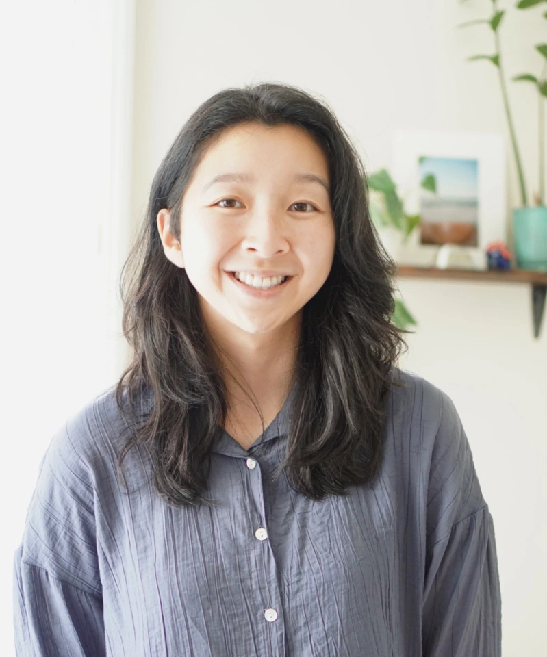 Emily Chen the NDNU student is smiling in this photograph.