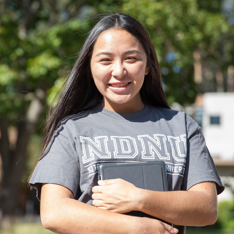 Student holding Ipad